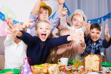 Group positive children having fun birthday party