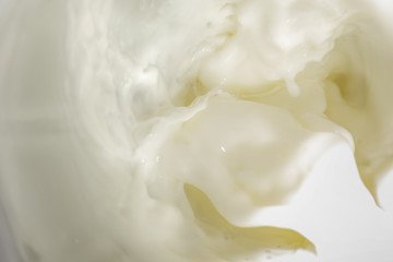 Abstract background of pouring fresh milk, soft focus