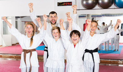 Happy kids karate group with coach © JackF