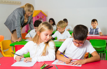 Fototapeta premium Boy and girl pupils of elementary school