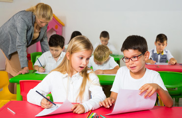 Fototapeta premium Children discussing during lesson