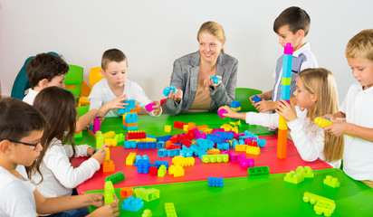 Group of children playing with colorful blocks