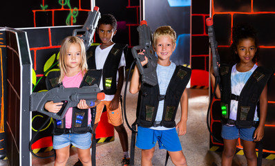 Group of lucky tweenagers with laser guns