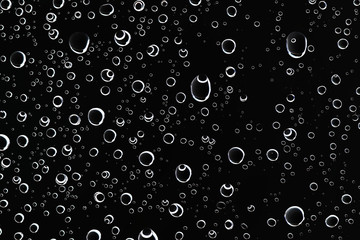 black wet background / raindrops for overlaying on window, concept of autumn weather, background of drops of water rain on glass transparent