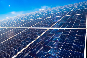 Large solar panel on a background of blue sky. Alternative energy.