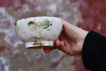 beautiful ceramic bowls in men 's hands