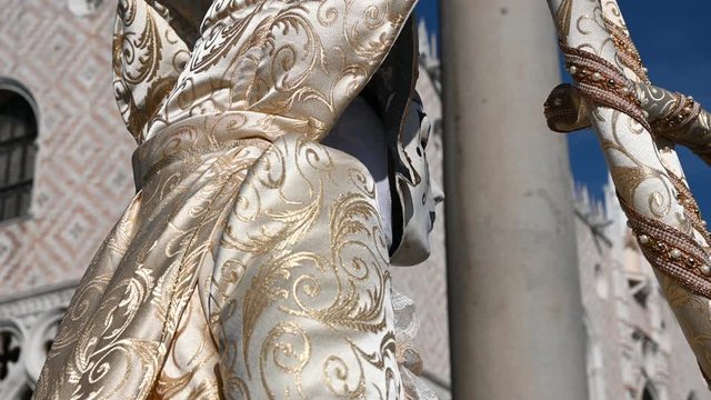 February 2020 Venice Carnival, Italy - carnival masks are photographed with tourists in Piazza San Marco