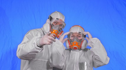 Doctor health worker in respirator. Slow motion. People portrait, wearing protect medical antibacterial antiviral aerosol spray paint mask.