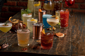 Many different multi-colored cocktails with different colors