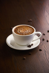 Cup of latte or Cappuccino on table in cafe.