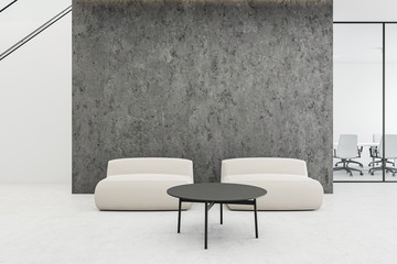 Armchairs in concrete office waiting room