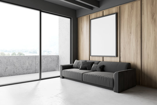 Wooden living room with sofa, poster and balcony