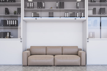 Beige sofa in white office lounge