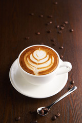 Cup of latte or Cappuccino on table in cafe.