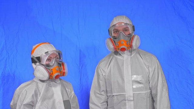 Doctor health worker in respirator. Slow motion. People portrait, wearing protect medical antibacterial antiviral aerosol spray paint mask. Concept health safety virus protection coronavirus epidemic.