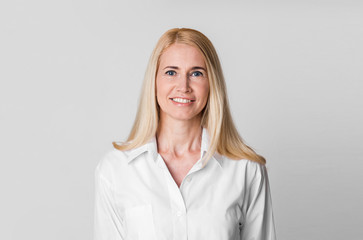 Natural beauty. Middle-aged woman smiling at camera