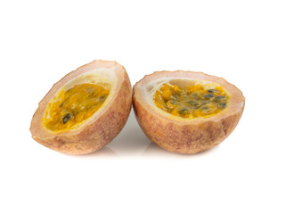 Whole passionfruit and a half maracuya fruit (Passiflora edulis) isolated on white background
