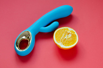 Sex toy. White Vibrator on a pink background