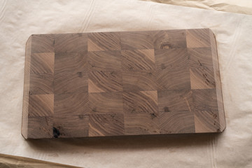 applying food safe oil finish to walnut cutting board composition