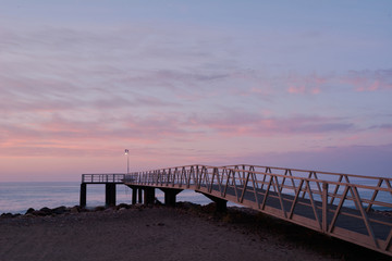 Obraz premium Footbridge in the threat to the Mediterranean Sea