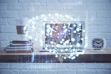 Double exposure of table with computer and brain hologram. Data innovation concept.