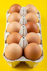 Brown eggs in box