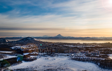 Fototapeta na wymiar Beautiful view of Viliuchinsky Volcano, Krasheninnikova Bay, Avacha Bay at sunrise. Kamchatka. Russia