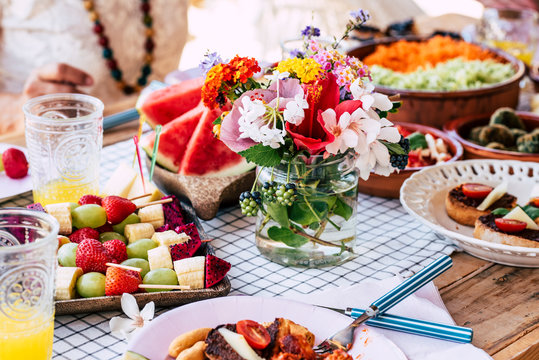 Close up of coloured frash tasty table full of healthy fodd - concept of restaurant or home celebration with vegetables and vegan food