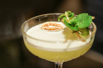 colored cocktails by the bar for people