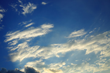 sunlight shine through cloud on dramatic blue sky background