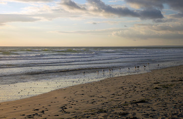 Fototapeta na wymiar The beginning of the sunset on the beach of the Atlantic coast