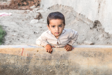 abandoned refugee boy in camp sad expressions and  his eyes are full of pain