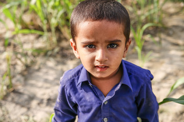 abandoned refugee boy in camp sad expressions and  his eyes are full of pain