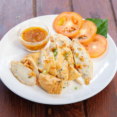 Sliced Chinese fish sausage with Thai spicy sauce