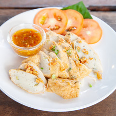 Sliced Chinese fish sausage with Thai spicy sauce