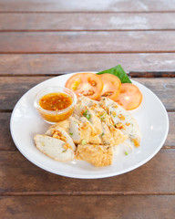 Sliced Chinese fish sausage with Thai spicy sauce