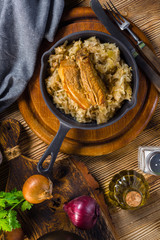Traditional spare ribs baked in sauerkraut.