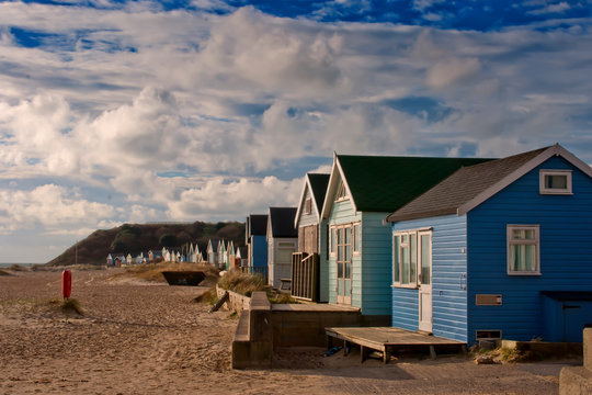 Hengistbury Head beach and beach huts near Bournemouth in Dorset, England