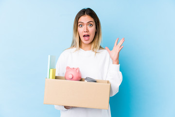 Young caucasian woman moving home isolated celebrating a victory or success