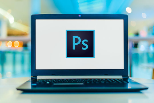 Laptop Computer Displaying Logo Of Adobe Photoshop