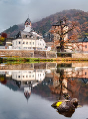 reflection of medieval towncentre in autumn