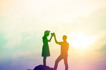 Fototapeta premium Couple enjoying outdoors in a wheat field.