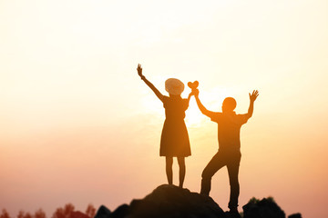 Couple enjoying outdoors in a wheat field.