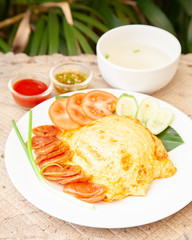 Rice topped with omelet and Chinese sausage