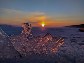 Beautiful winter sunset through the ice