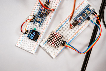 professional engineer assemble the details of device with pcb controller and counter with numbers