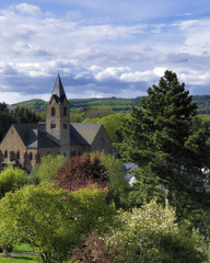 View with church and clouds in Ulmen, Germany