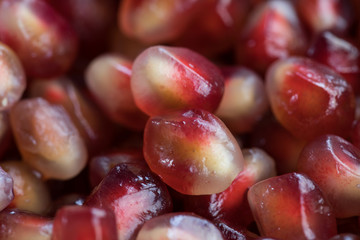 Pomegranate in a close-up visible grain texture