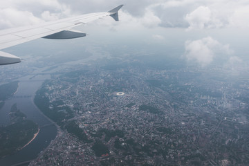 Fototapeta na wymiar Kiev city with airplane window, Ukraine