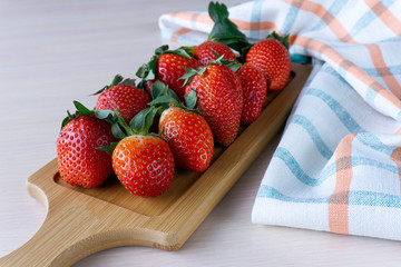 fresh strawberries on a serving board.